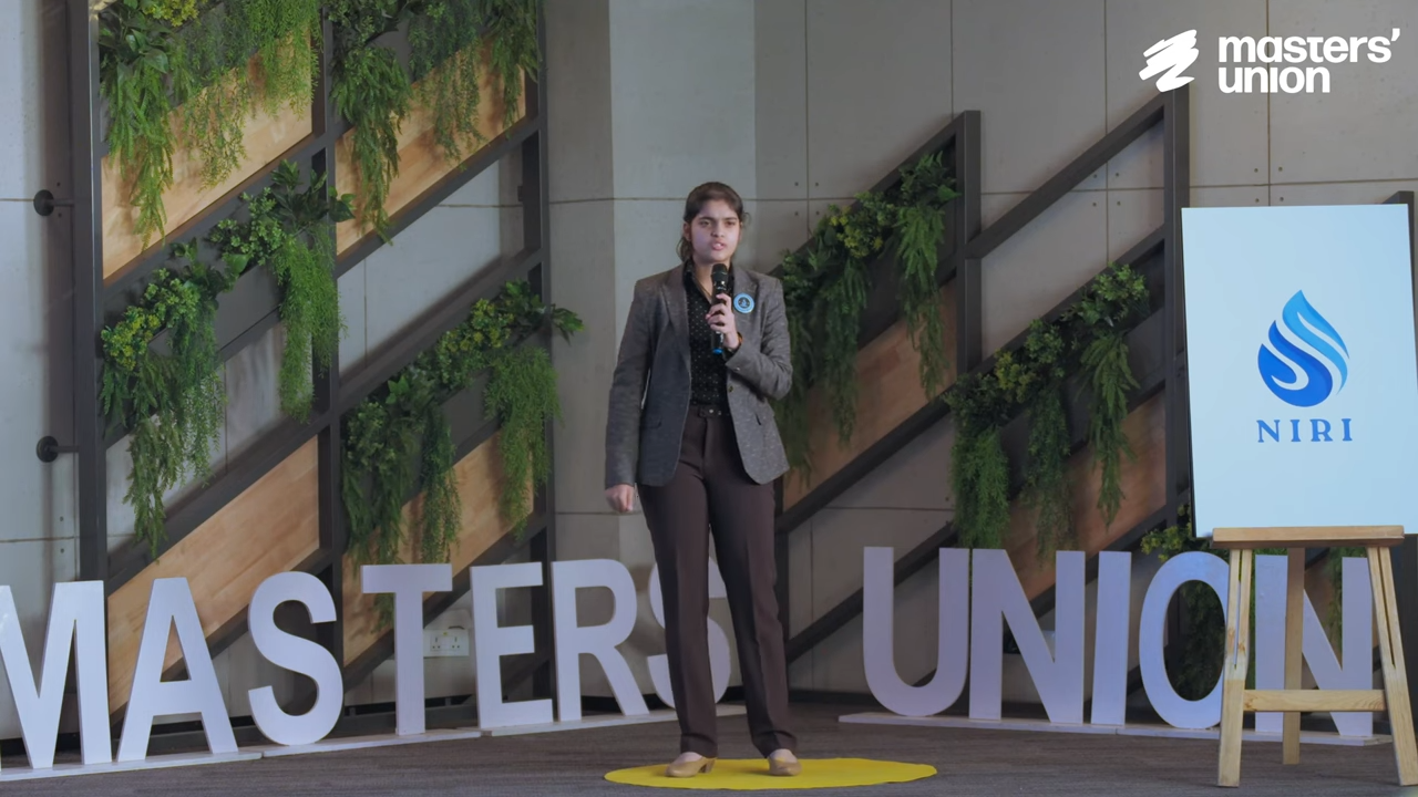 Aadya speaking at an event